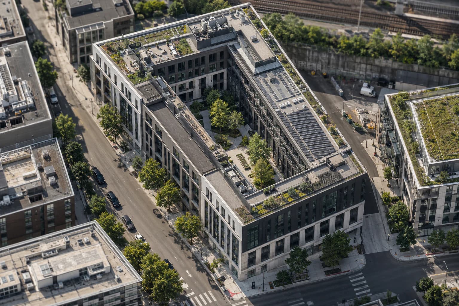 A complete mixed-use development arranged around a landscaped urban courtyard